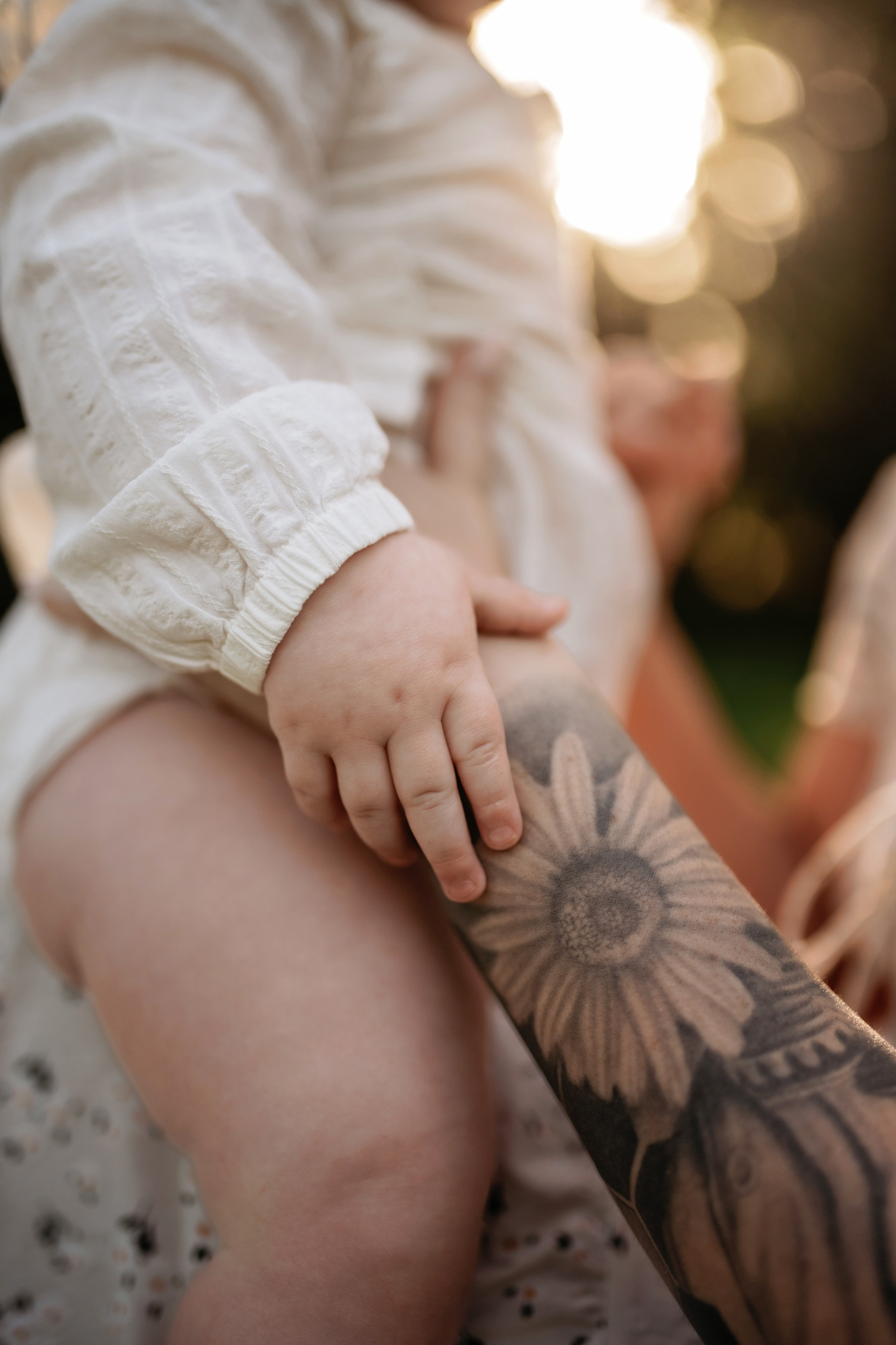 Daughter holds her mother hand during family photoshoot in Baldwin Park FL