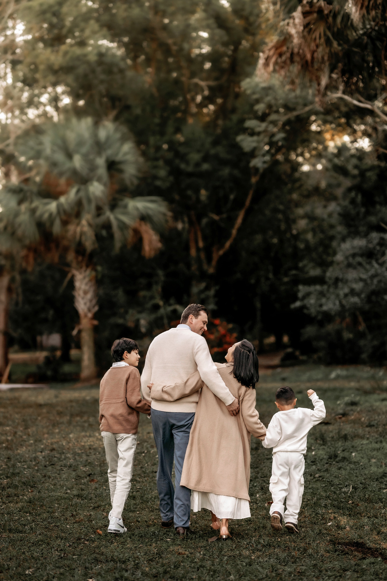 Family of four walking during sunset photoshoot in Orlando