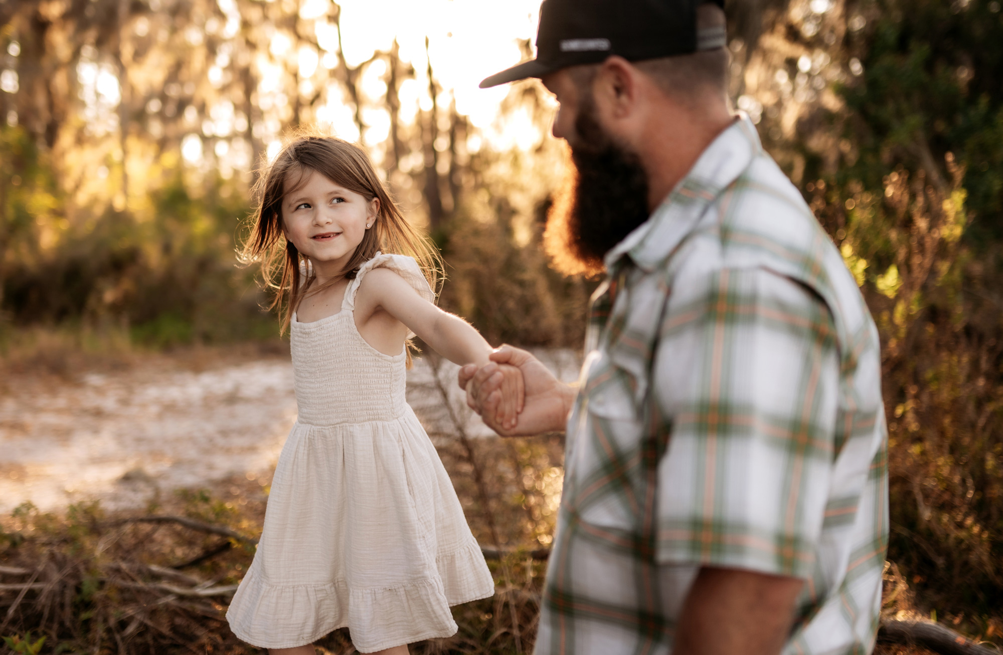 Family walking together during an outdoor photo session in Orlando, Florida