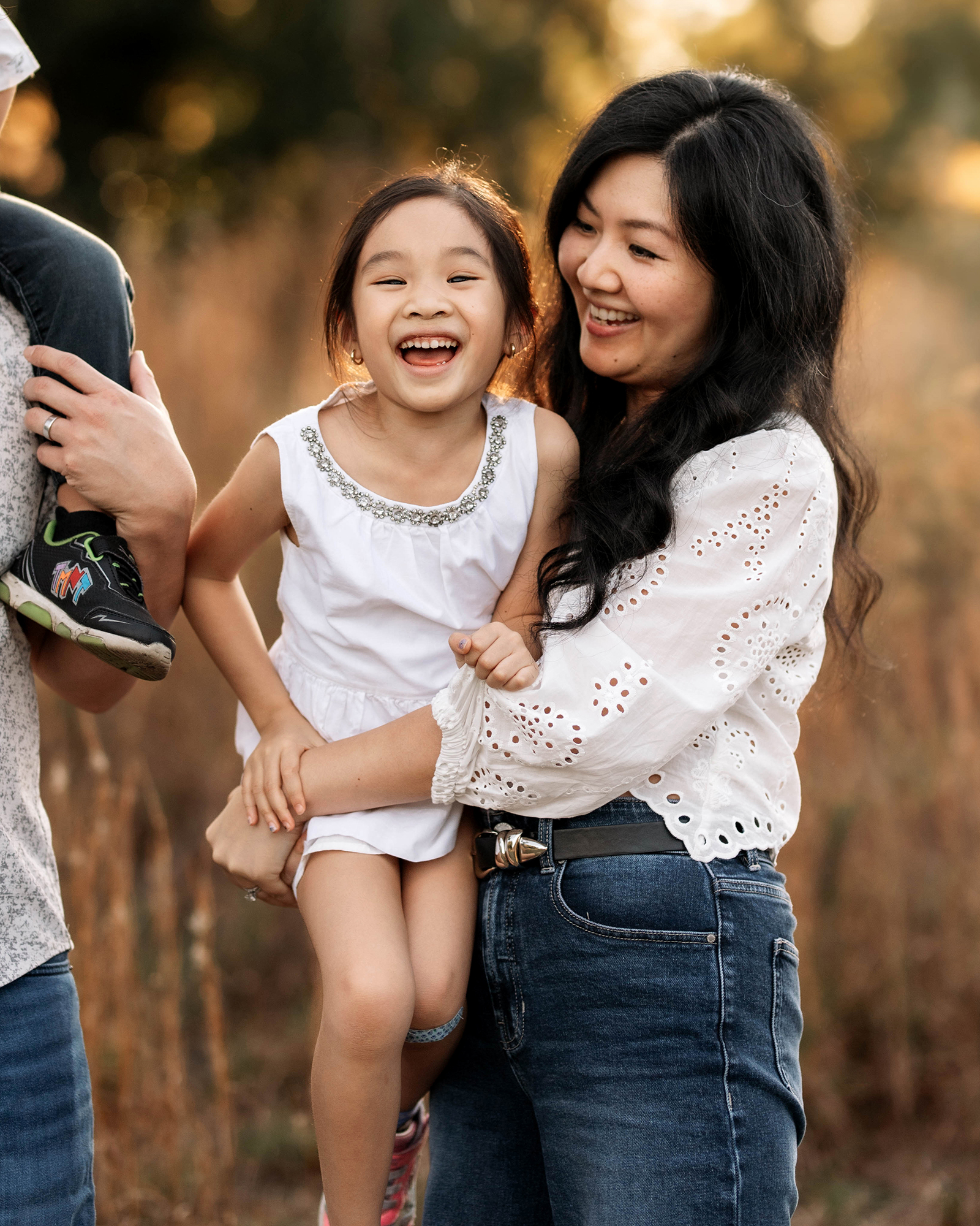 Orlando family portraits with children in a soft outdoor setting during golden hour.