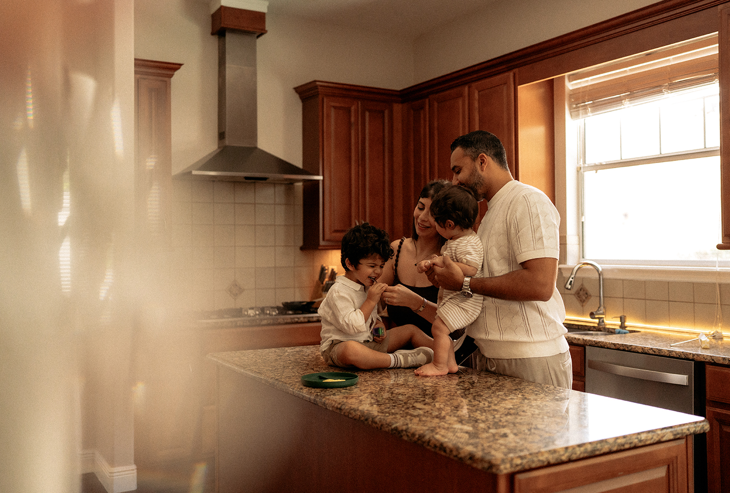 Family sharing playful moments together during a lifestyle photography session in Orlando, Florida